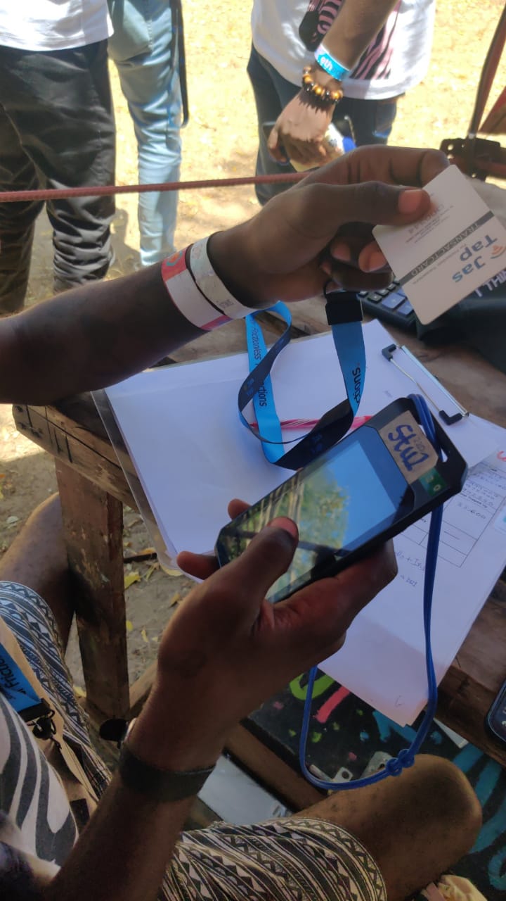 Person tapping NFC on phone